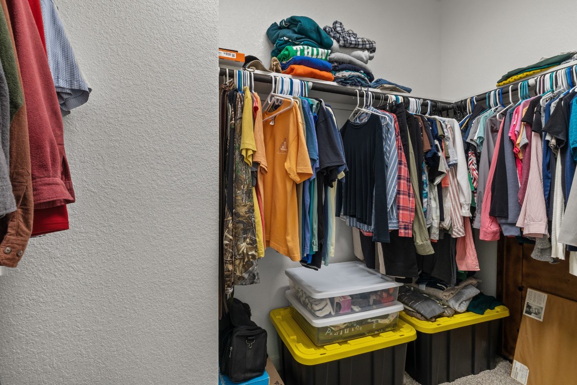 1217 Red Hills Drive Rosharon, TX 77583 - Photo 15 of 25 a view of walk in closet with clothes and shoes