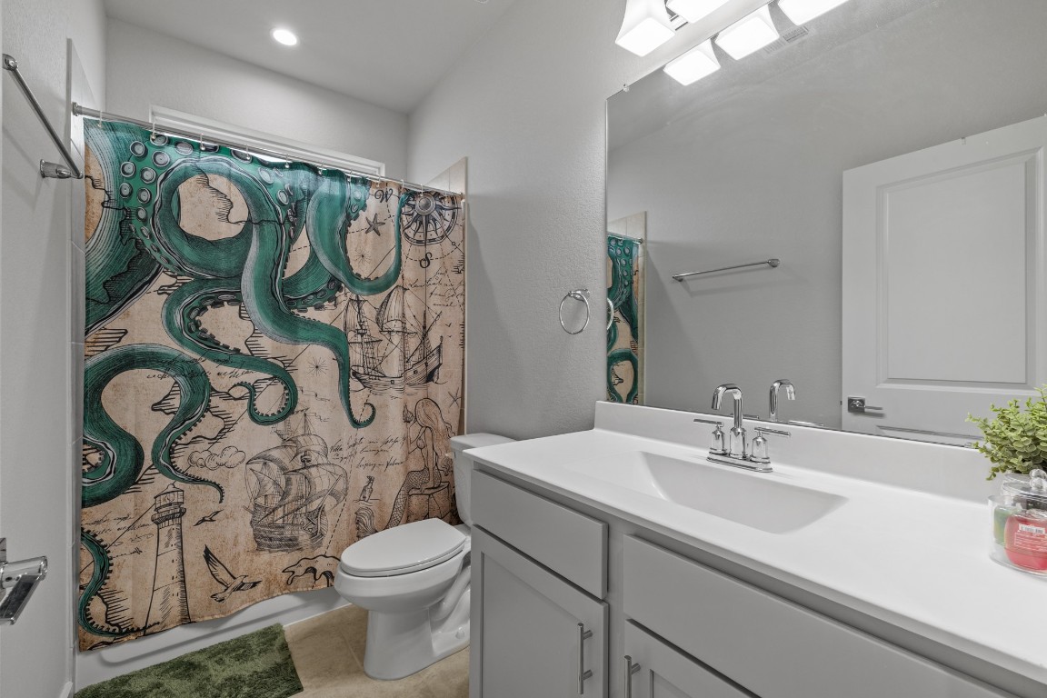 1217 Red Hills Drive Rosharon, TX 77583 - Photo 18 of 25 a bathroom with a sink and mirror