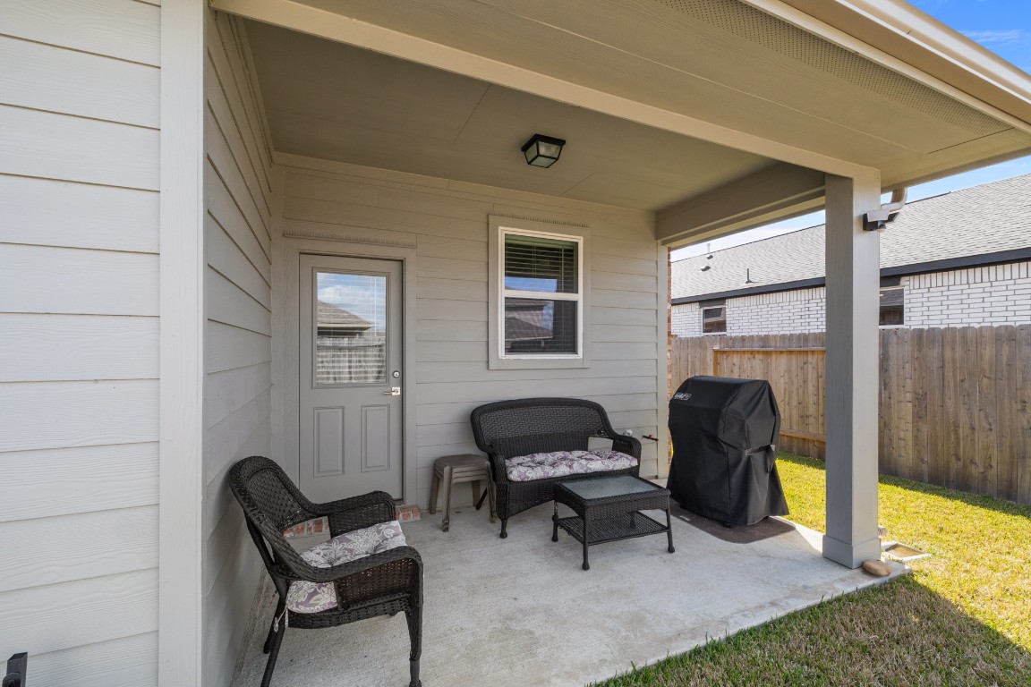 1217 Red Hills Drive Rosharon, TX 77583 - Photo 22 of 25 a living room with furniture and a fireplace