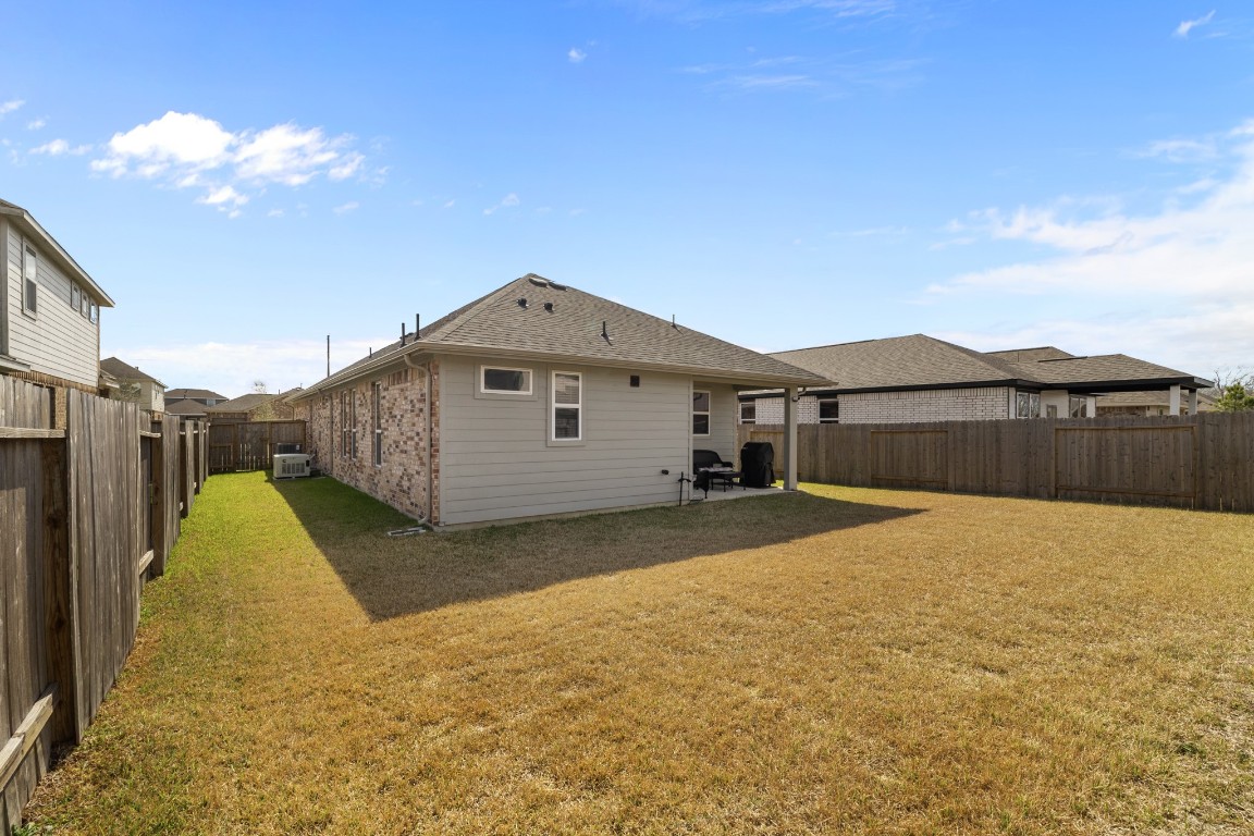 1217 Red Hills Drive Rosharon, TX 77583 - Photo 23 of 25 a view of a house with a yard
