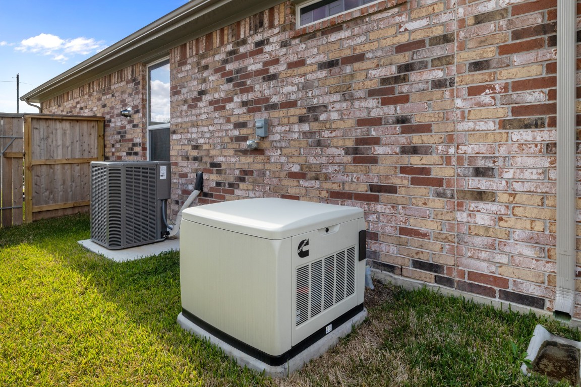 1217 Red Hills Drive Rosharon, TX 77583 - Photo 24 of 25 a utility room with a wooden fence