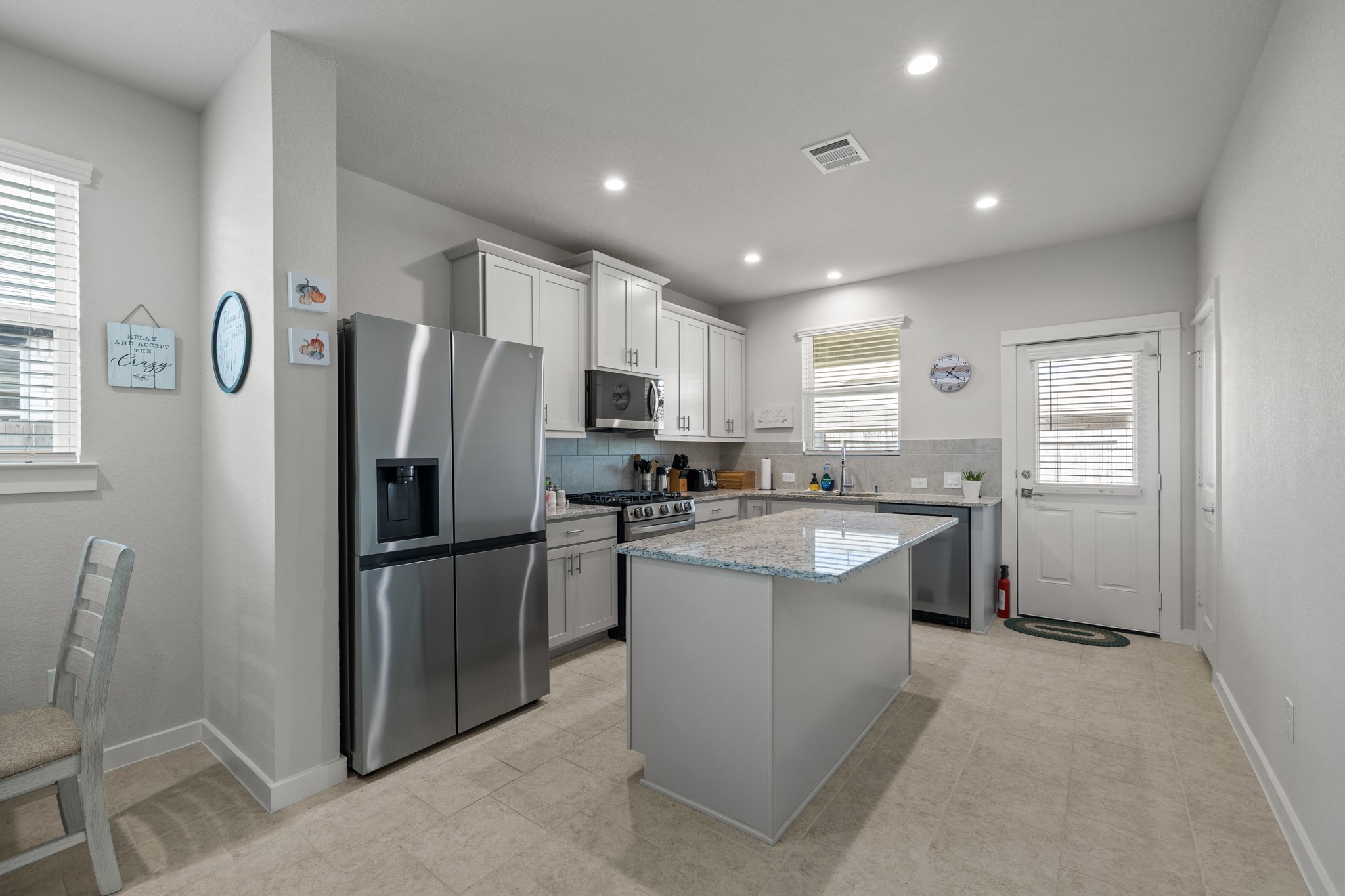 1217 Red Hills Drive Rosharon, TX 77583 - Photo 9 of 25 a kitchen with refrigerator and window
