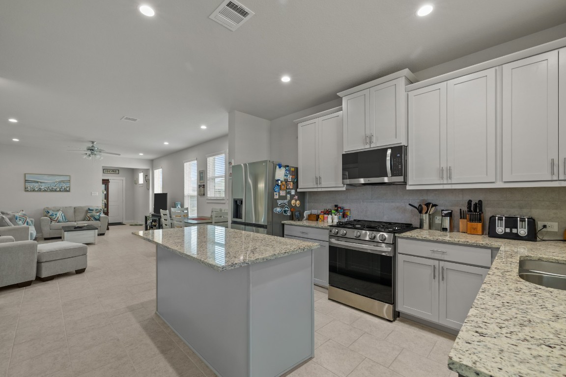 1217 Red Hills Drive Rosharon, TX 77583 - Photo 10 of 25 a large kitchen with granite countertop lots of counter top space