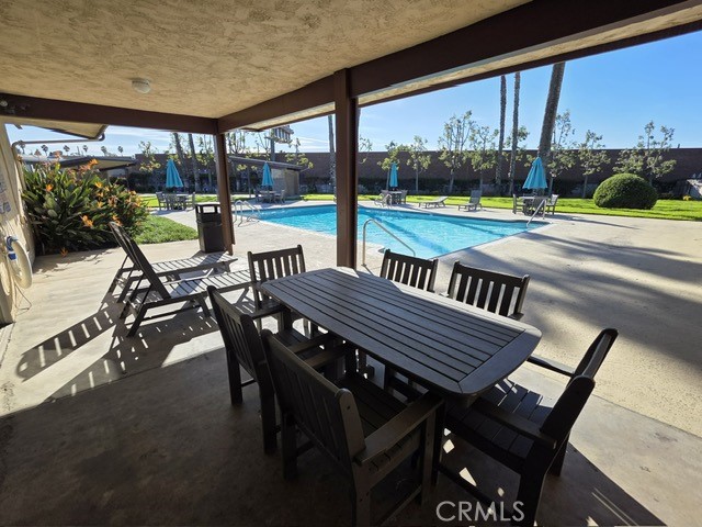 1560 Massachusetts Riverside, CA 92507 - Photo 25 of 26 a view of a patio with a table chairs and a backyard
