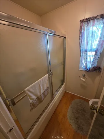 a view of room with window and hallway