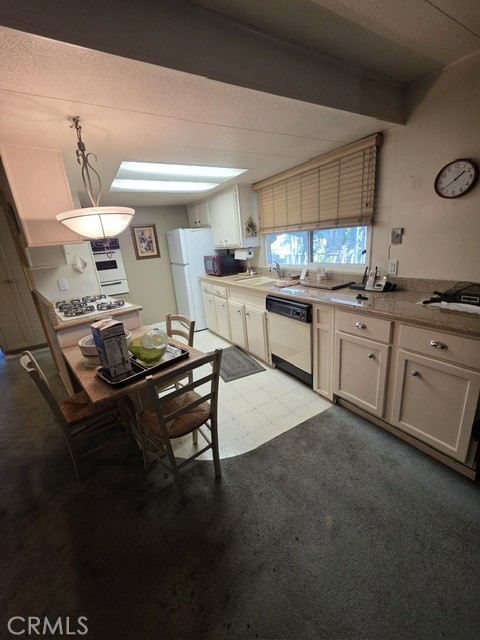 1560 Massachusetts Riverside, CA 92507 - Photo 9 of 26 a kitchen with a sink appliances and cabinets
