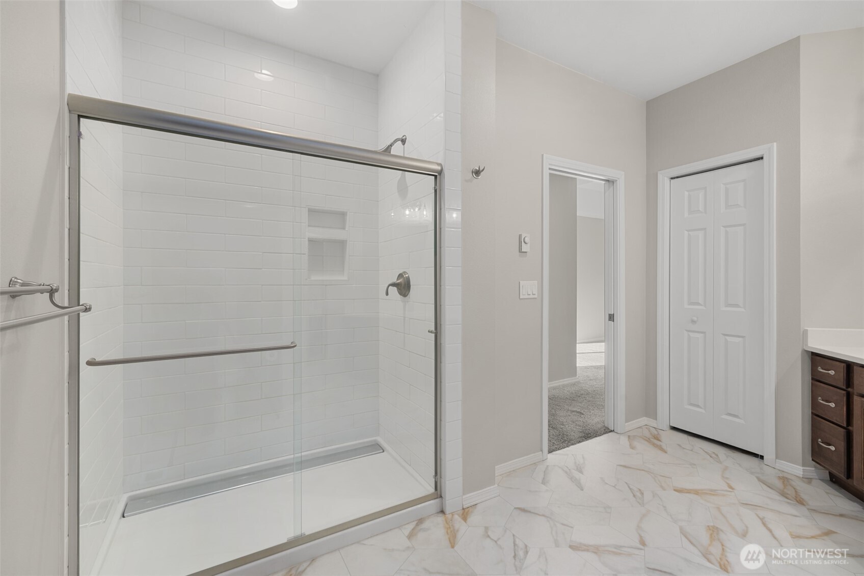 191 Cascadia Loop Sequim, WA 98382 - Photo 13 of 40 a bathroom with a glass shower door
