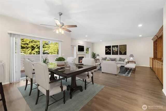 a living room with furniture dining table a window and appliances