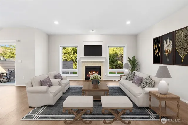a living room with furniture fireplace and window