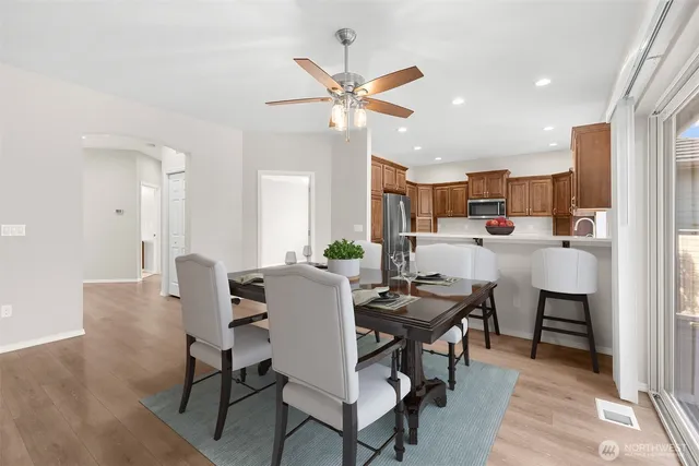 a dining room with furniture and window
