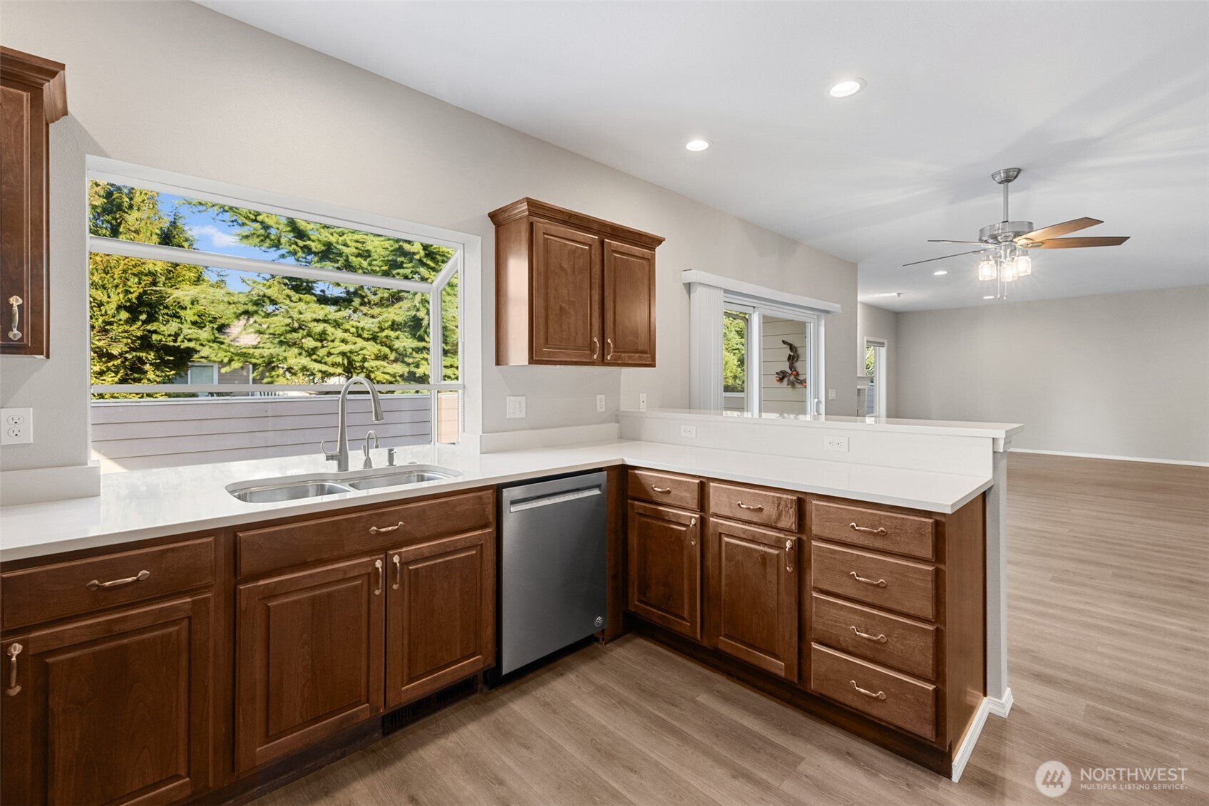 191 Cascadia Loop Sequim, WA 98382 - Photo 31 of 40 a kitchen with a sink window and cabinets