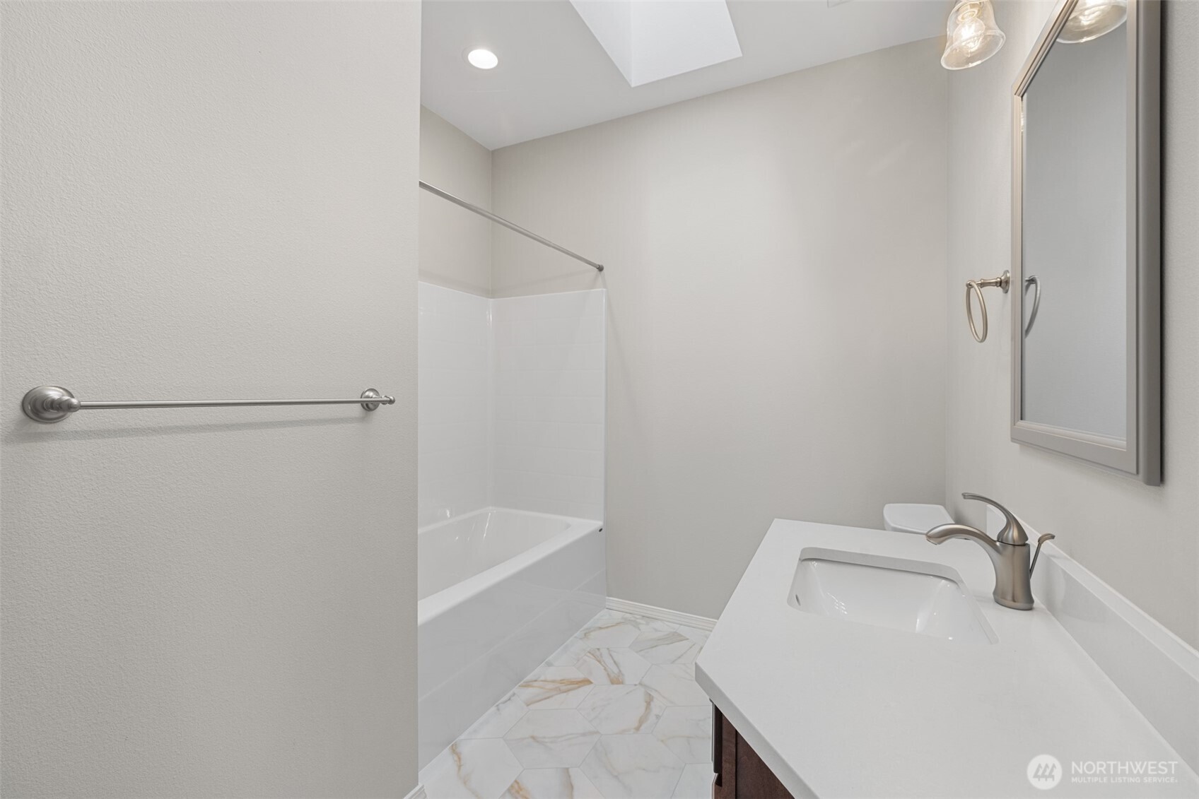 191 Cascadia Loop Sequim, WA 98382 - Photo 34 of 40 a bathroom with a sink and shower