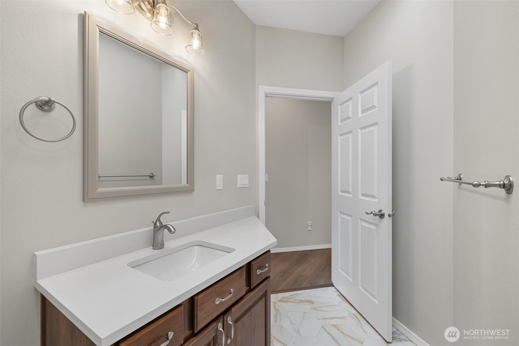 191 Cascadia Loop Sequim, WA 98382 - Photo 35 of 40 a bathroom with a sink and a mirror
