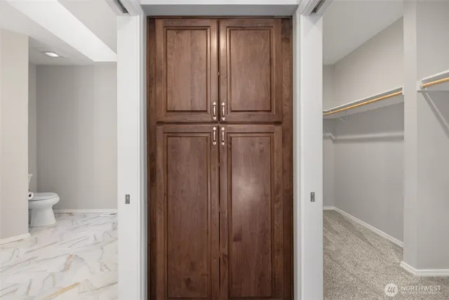 a view of a bathroom with toilet shower and a sink