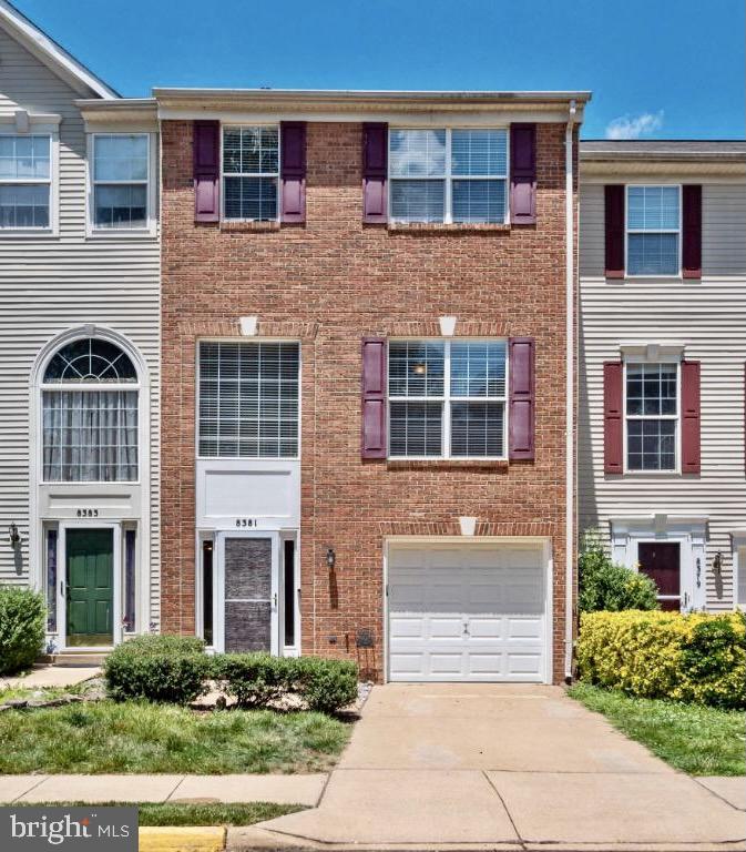 8381 Jovin Circle Springfield, VA 22153 - Photo 1 of 16 a front view of a house with a garden