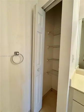 a bathroom with a granite countertop shower