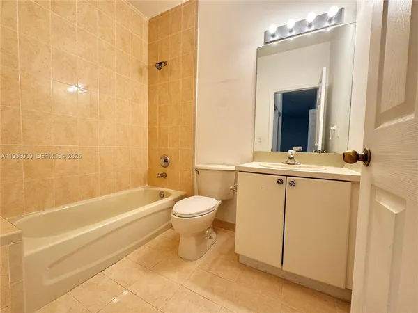 a bathroom with a toilet a sink and bathtub