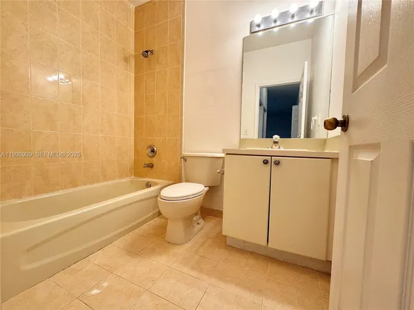 a bathroom with a toilet a sink and shower