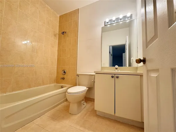 a bathroom with a toilet a sink and a bathtub
