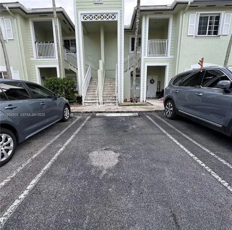 a view of a car parked in front of a house