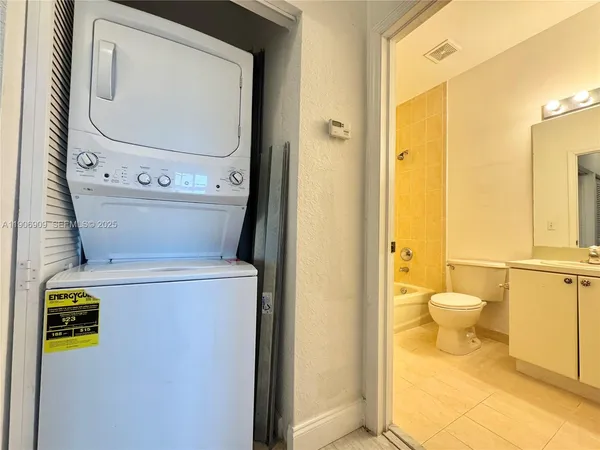 a bathroom with a toilet and a mirror