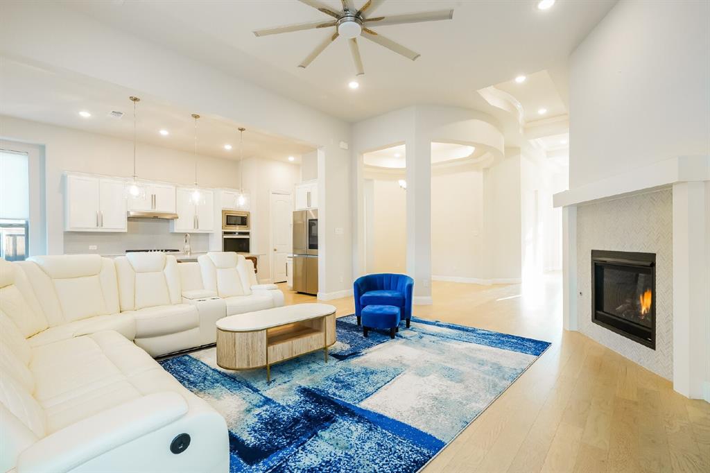 2000 Johnson Road Mansfield, TX 76063 - Photo 8 of 27 Recessed lighting, wood-finish flooring, and a ceiling fan