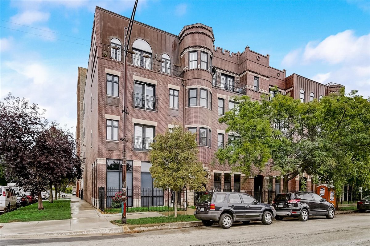 523 North Racine Avenue, Unit 1 Chicago, IL 60642 - Photo 1 of 18 a car parked in front of a building