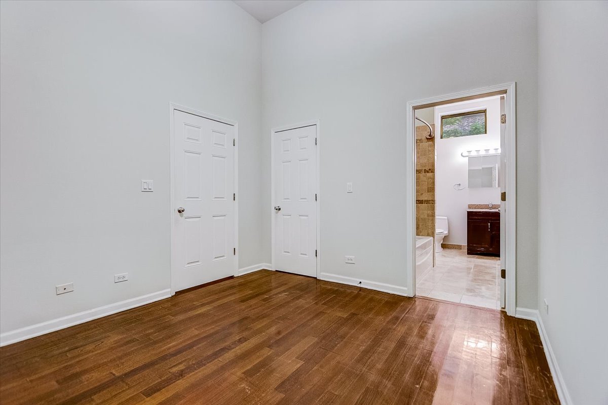 523 North Racine Avenue, Unit 1 Chicago, IL 60642 - Photo 12 of 18 wooden floor in an empty room