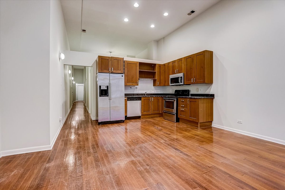 523 North Racine Avenue, Unit 1 Chicago, IL 60642 - Photo 5 of 18 a view of kitchen with wooden floor