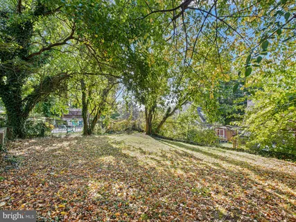 a picture of a park with a bench