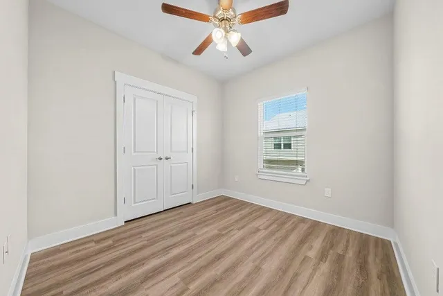 a view of a room with wooden floor