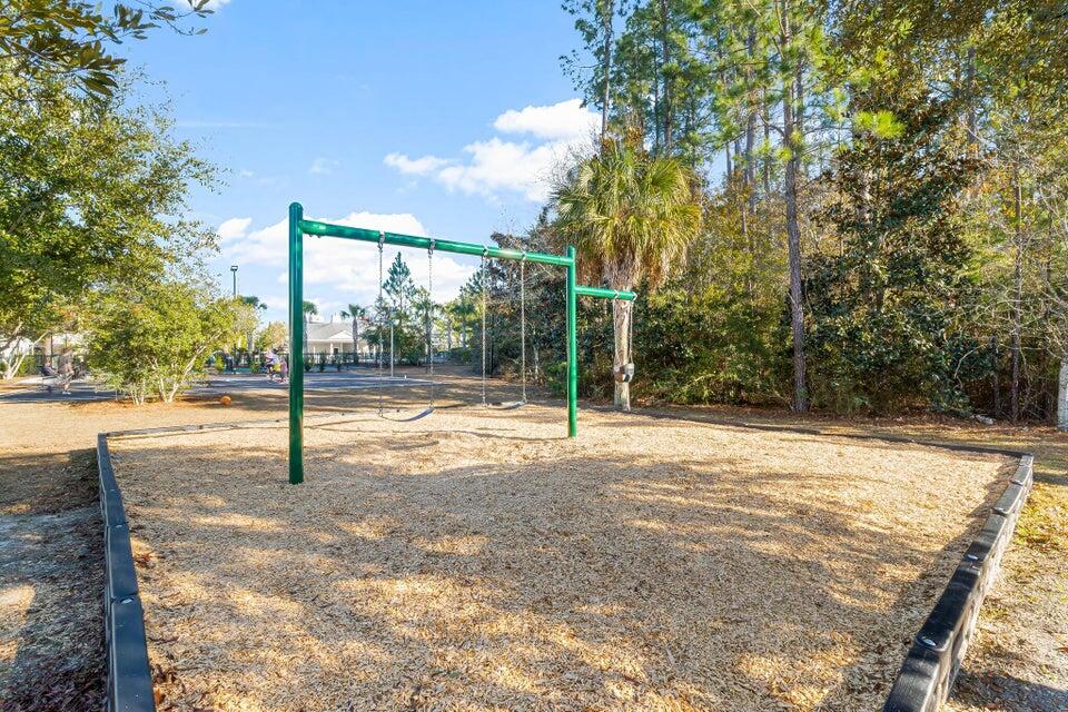 289 North Sand Palm Road, Unit VISTA Freeport, FL 32439 - Photo 33 of 34 a view of a house with backyard and a tree