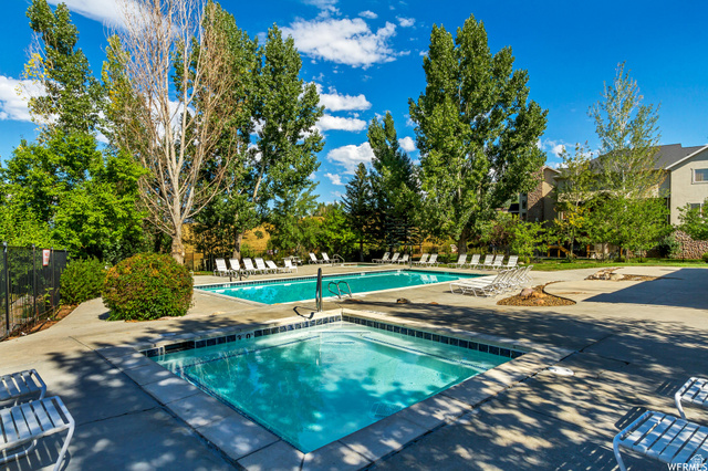 3598 North Huntsman Path, Unit 502 Eden, UT 84310 - Photo 29 of 43 Community pool featuring a patio and a community hot tub