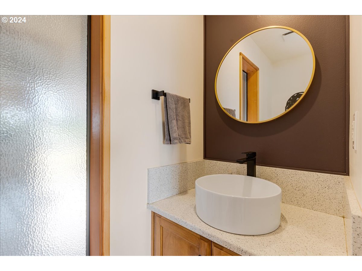 1500 Southwest Walters Drive Gresham, OR 97080 - Photo 12 of 48 a bathroom with a sink and a mirror