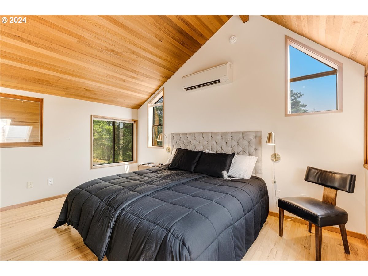 1500 Southwest Walters Drive Gresham, OR 97080 - Photo 16 of 48 a bedroom with a bed and a night stand