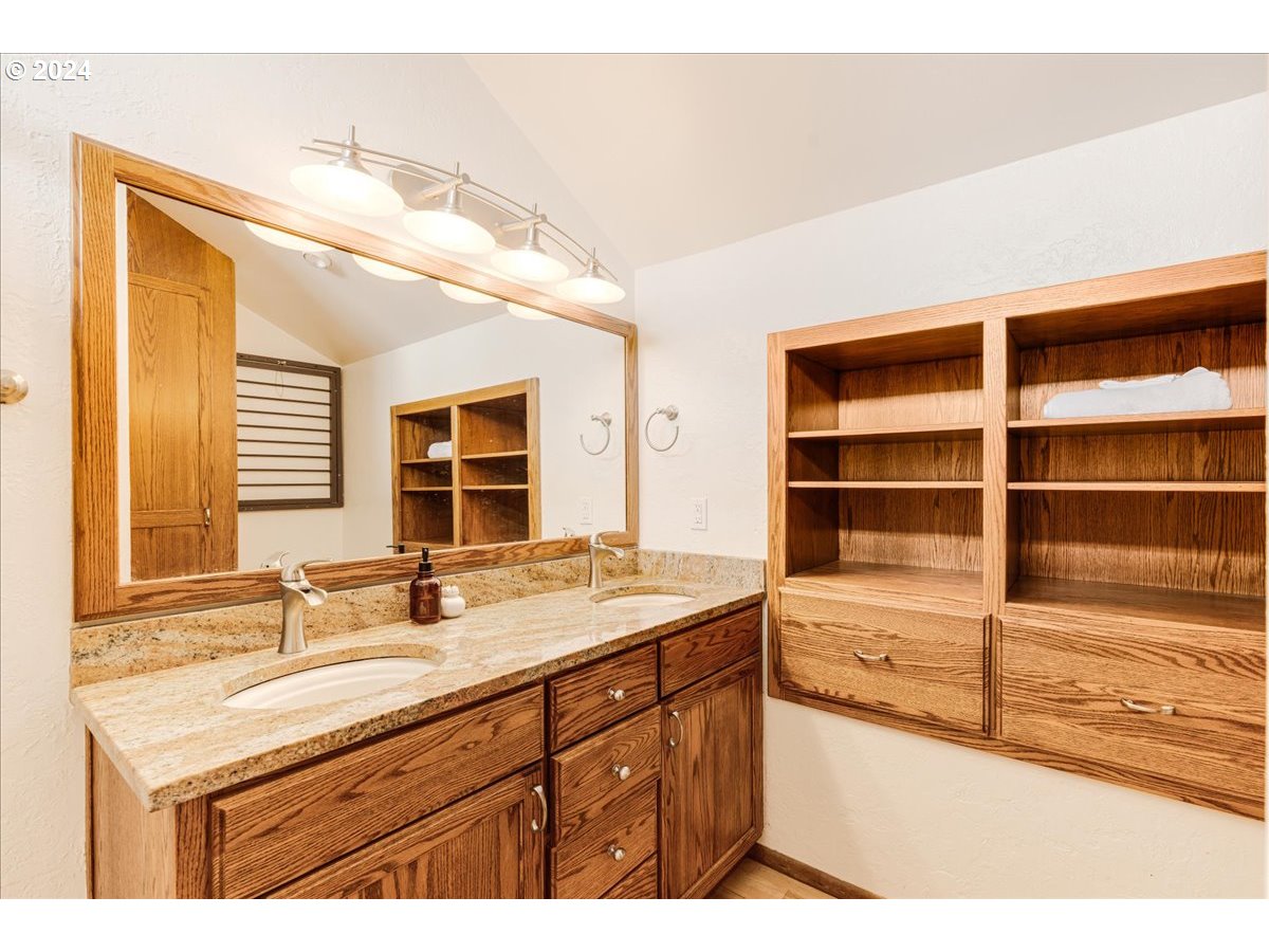 1500 Southwest Walters Drive Gresham, OR 97080 - Photo 17 of 48 a bathroom with a sink double vanity and a tub