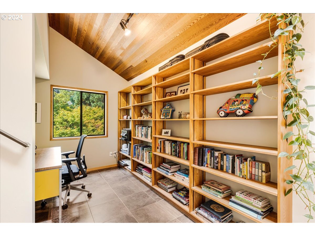 1500 Southwest Walters Drive Gresham, OR 97080 - Photo 20 of 48 a view of a workspace with furniture and a bookshelf