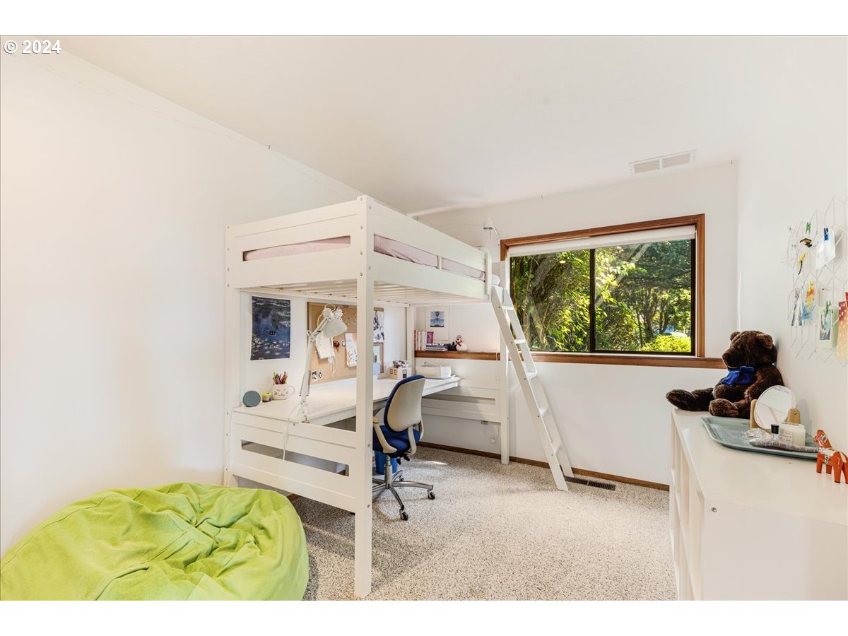 1500 Southwest Walters Drive Gresham, OR 97080 - Photo 25 of 48 a living room with furniture a window and a flat screen tv
