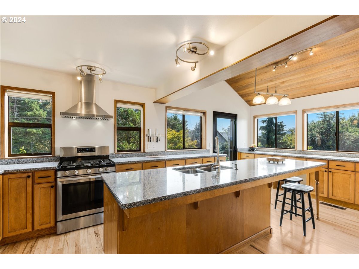 1500 Southwest Walters Drive Gresham, OR 97080 - Photo 3 of 48 a kitchen with stainless steel appliances granite countertop a stove and a sink