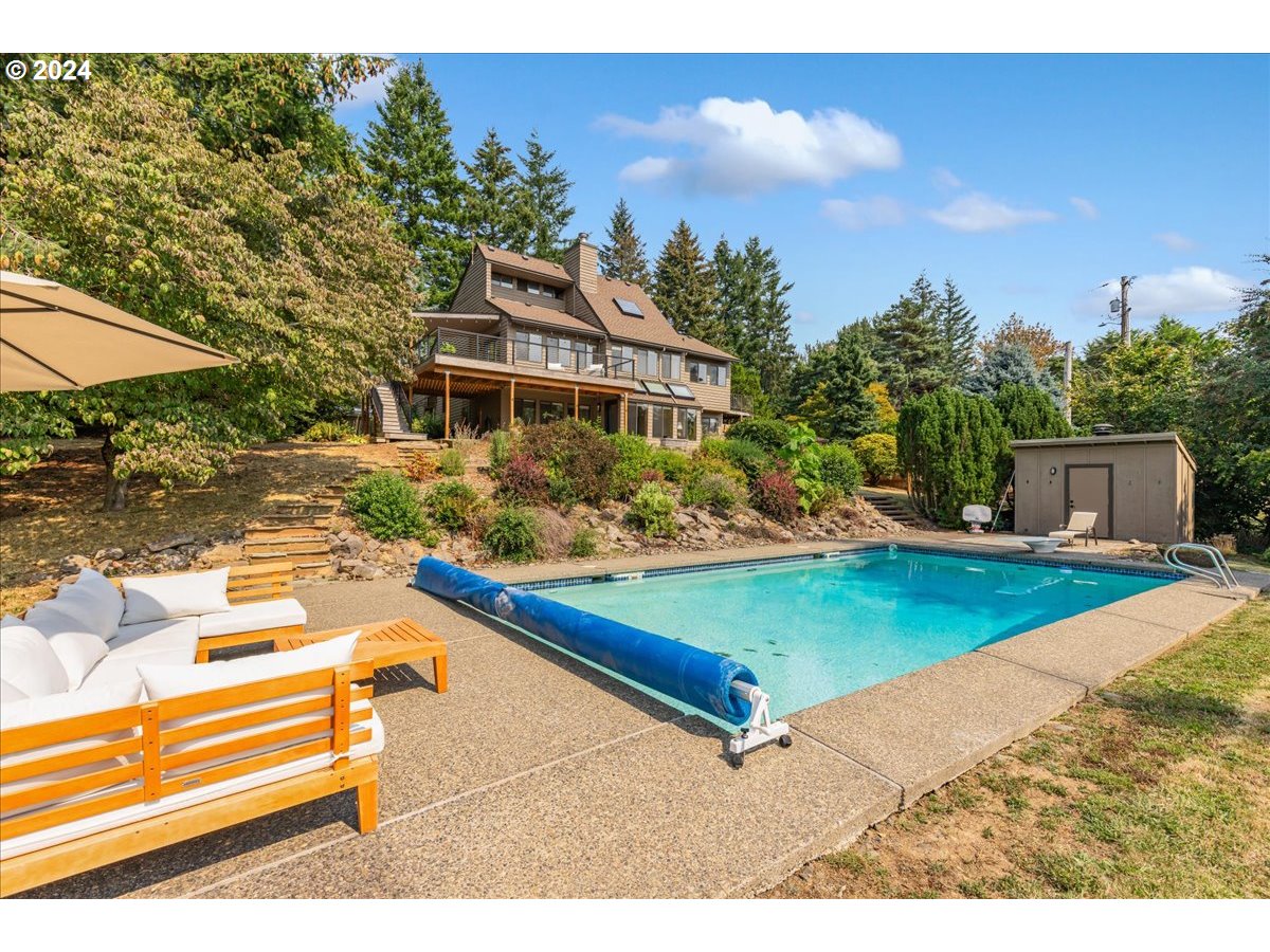 1500 Southwest Walters Drive Gresham, OR 97080 - Photo 42 of 48 a view of a house with pool and chairs