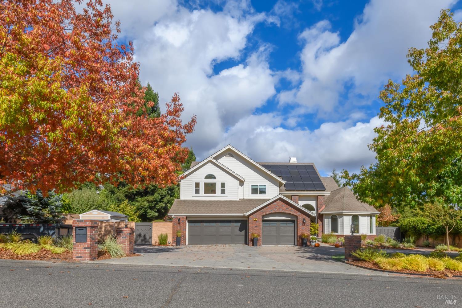 a view of house with yard and entertaining space