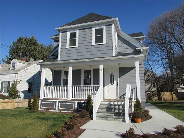 98 Harris Street Fairfield, CT 06824 - Photo 1 of 1 front view of a house with a yard
