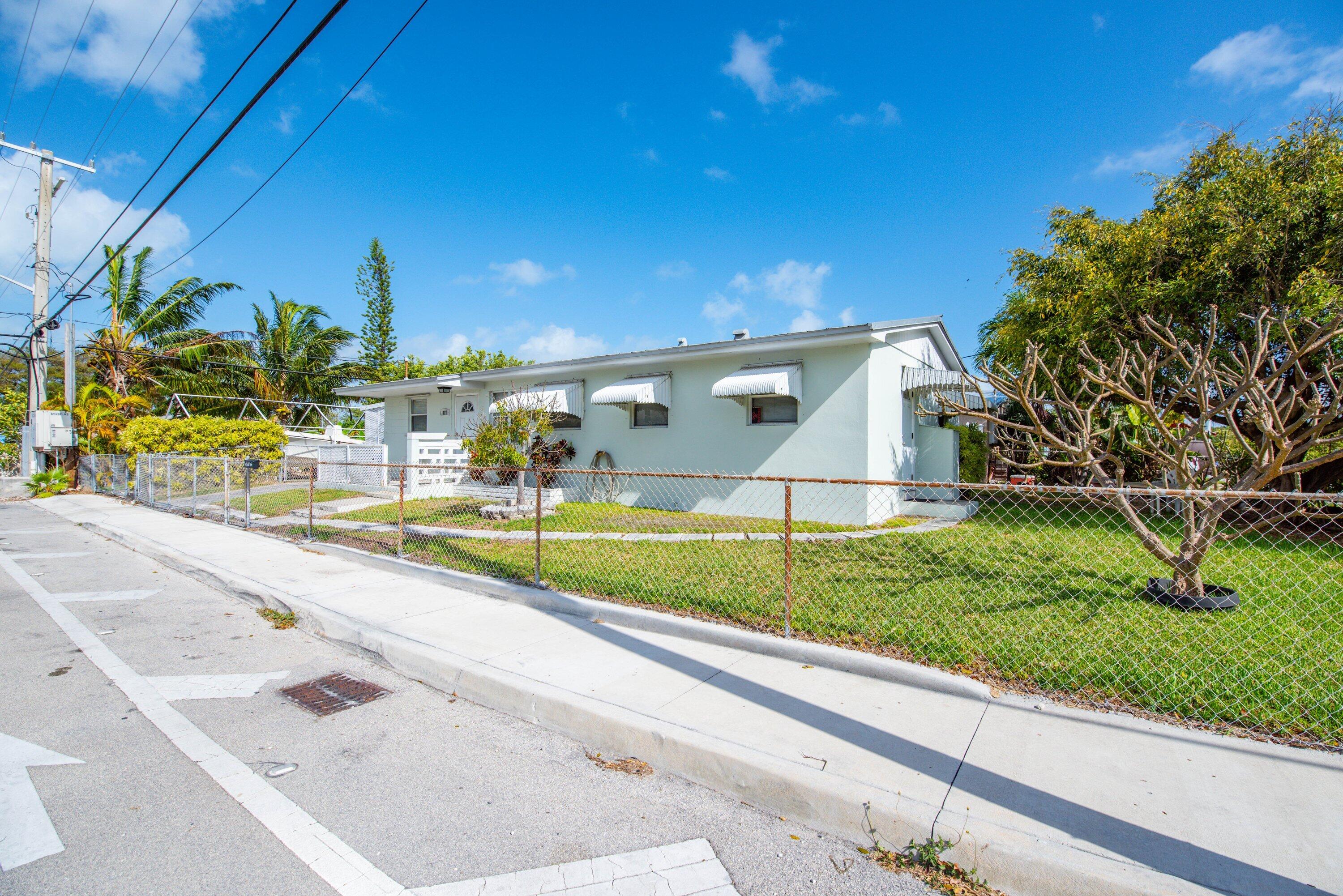 317 Cross Street Stock Island, FL 33040 - Photo 1 of 25 a view of a swimming pool and outdoor space