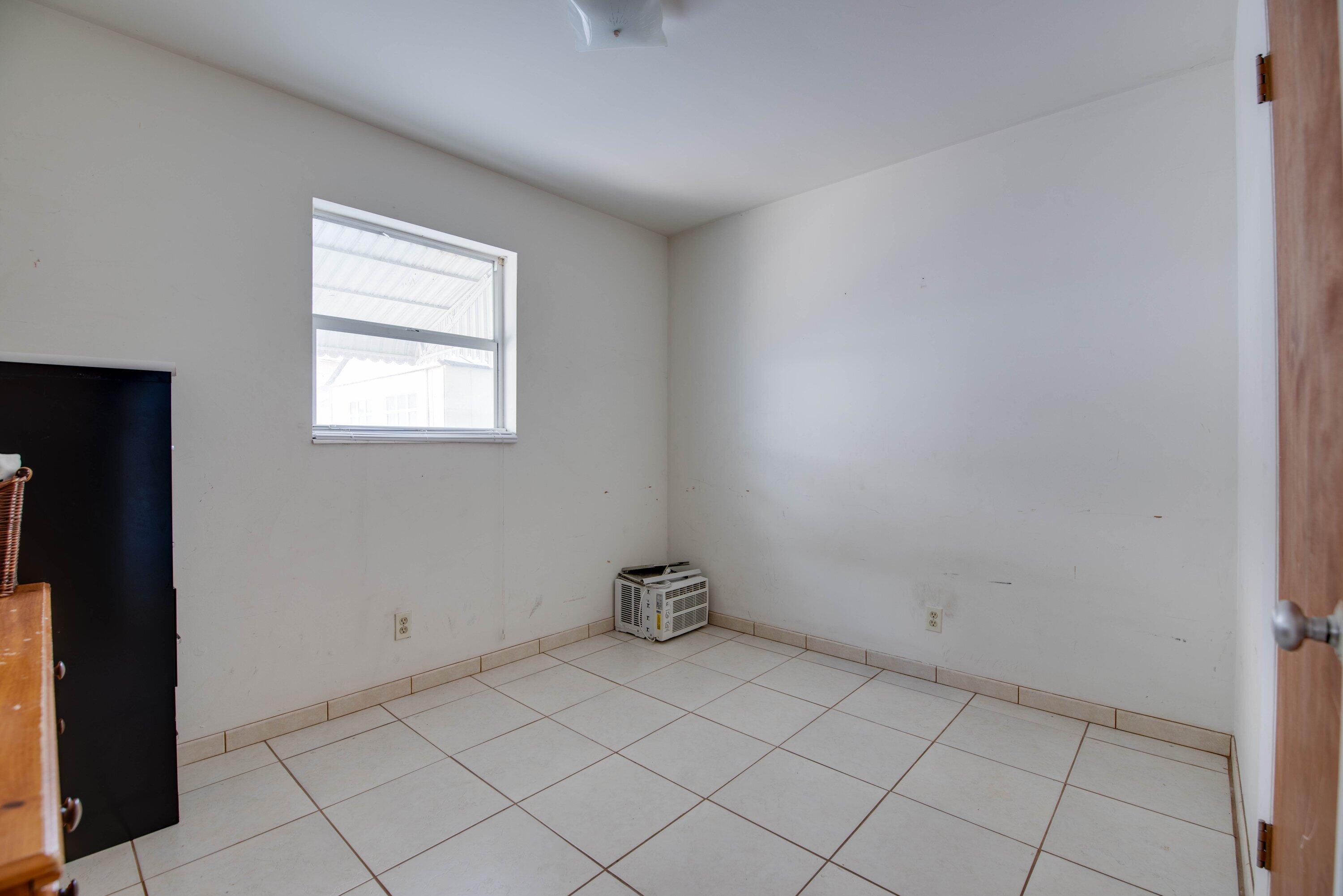 317 Cross Street Stock Island, FL 33040 - Photo 13 of 25 an empty room with windows