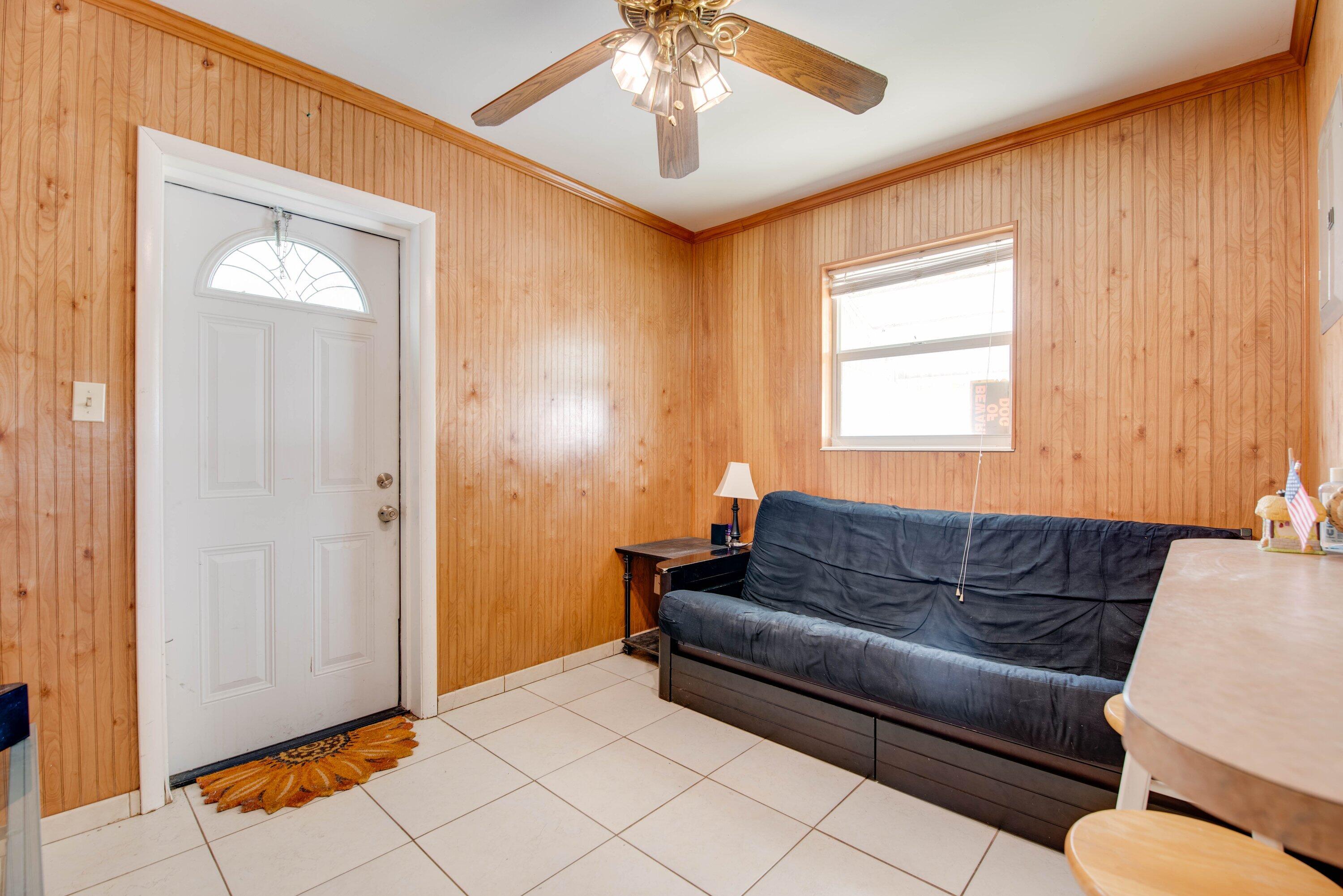 317 Cross Street Stock Island, FL 33040 - Photo 16 of 25 a living room with furniture and a window