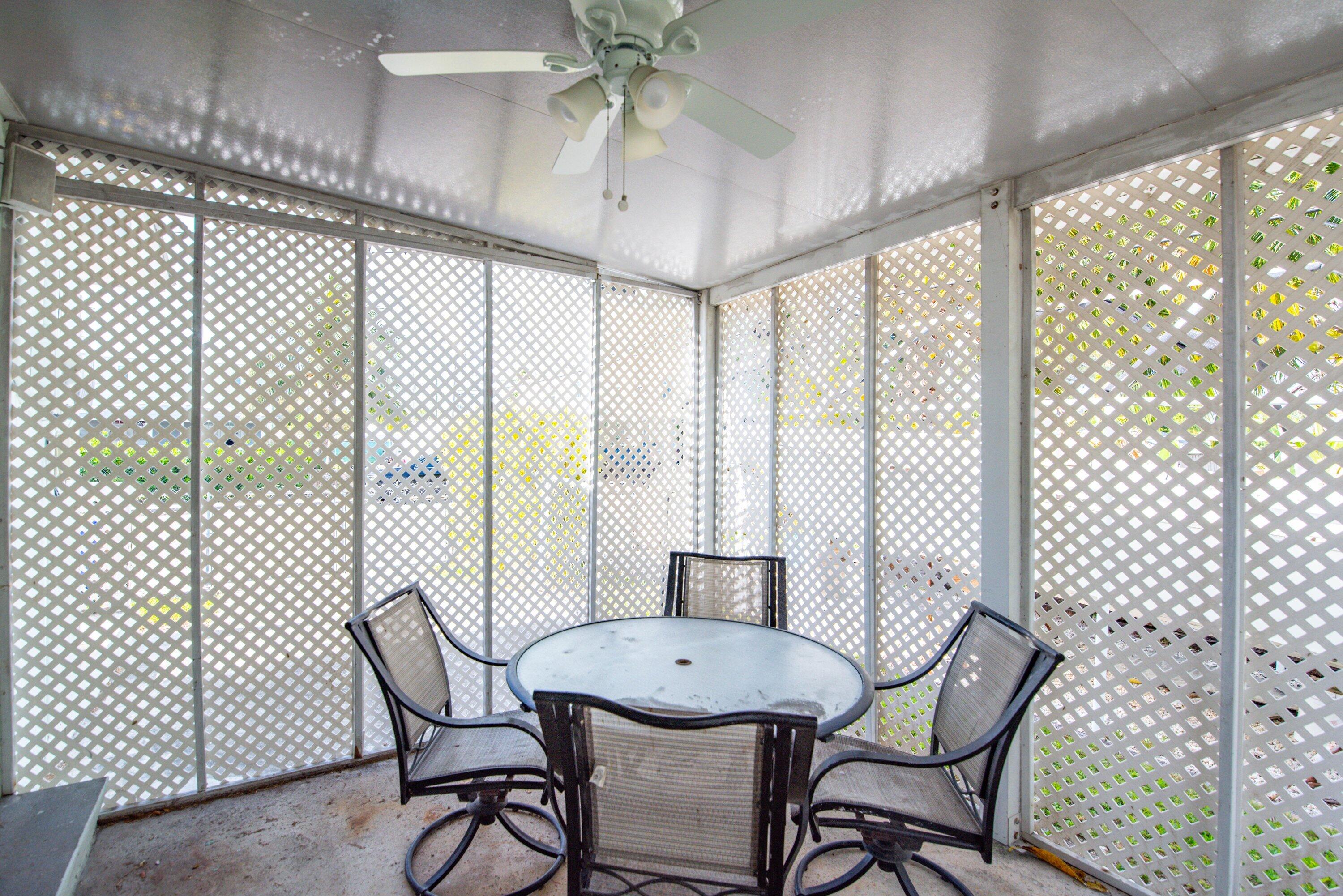 317 Cross Street Stock Island, FL 33040 - Photo 23 of 25 a view of a dining room with furniture window and outside view
