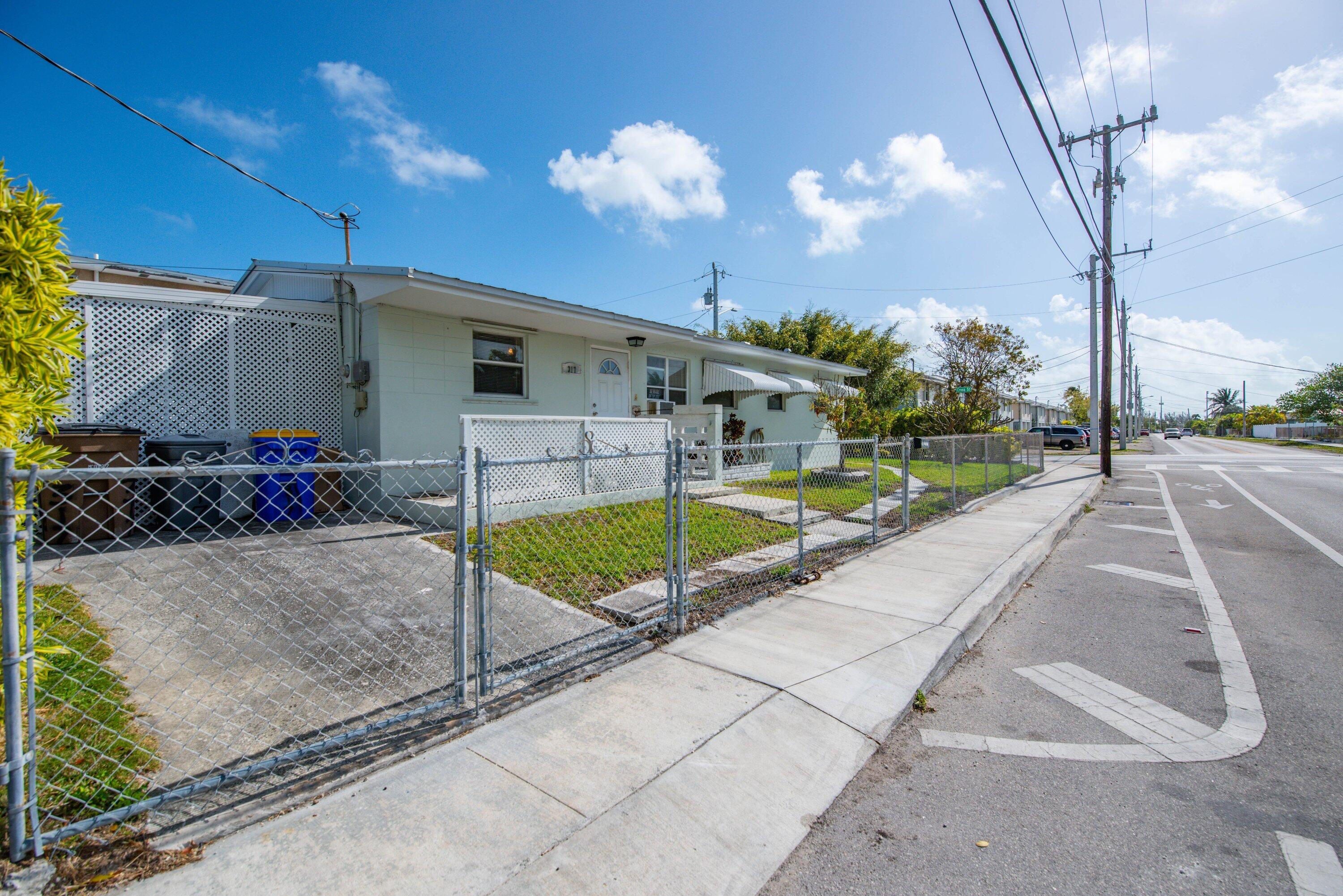 317 Cross Street Stock Island, FL 33040 - Photo 4 of 25 a view of a house with backyard and sitting area