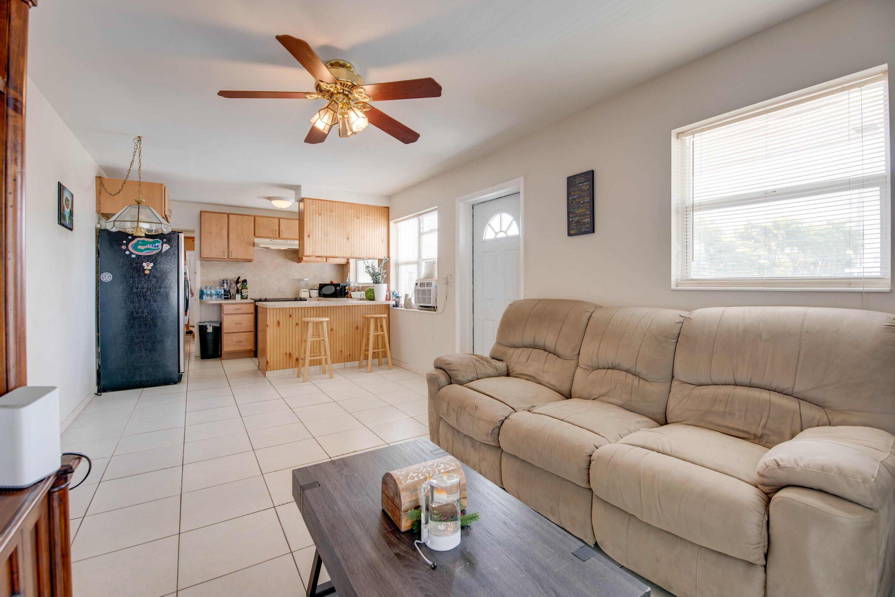 317 Cross Street Stock Island, FL 33040 - Photo 6 of 25 a living room with furniture and kitchen view