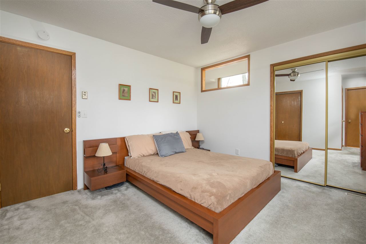 1098 Drexel Road Lake Summerset, IL 61019 - Photo 14 of 25 a bedroom with a bed and a chandelier