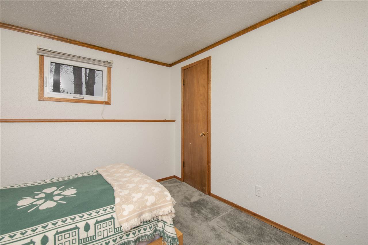 1098 Drexel Road Lake Summerset, IL 61019 - Photo 19 of 25 a bedroom with a bed and a wall painting